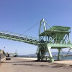 Load hopper for feed materials and belt conveyor.